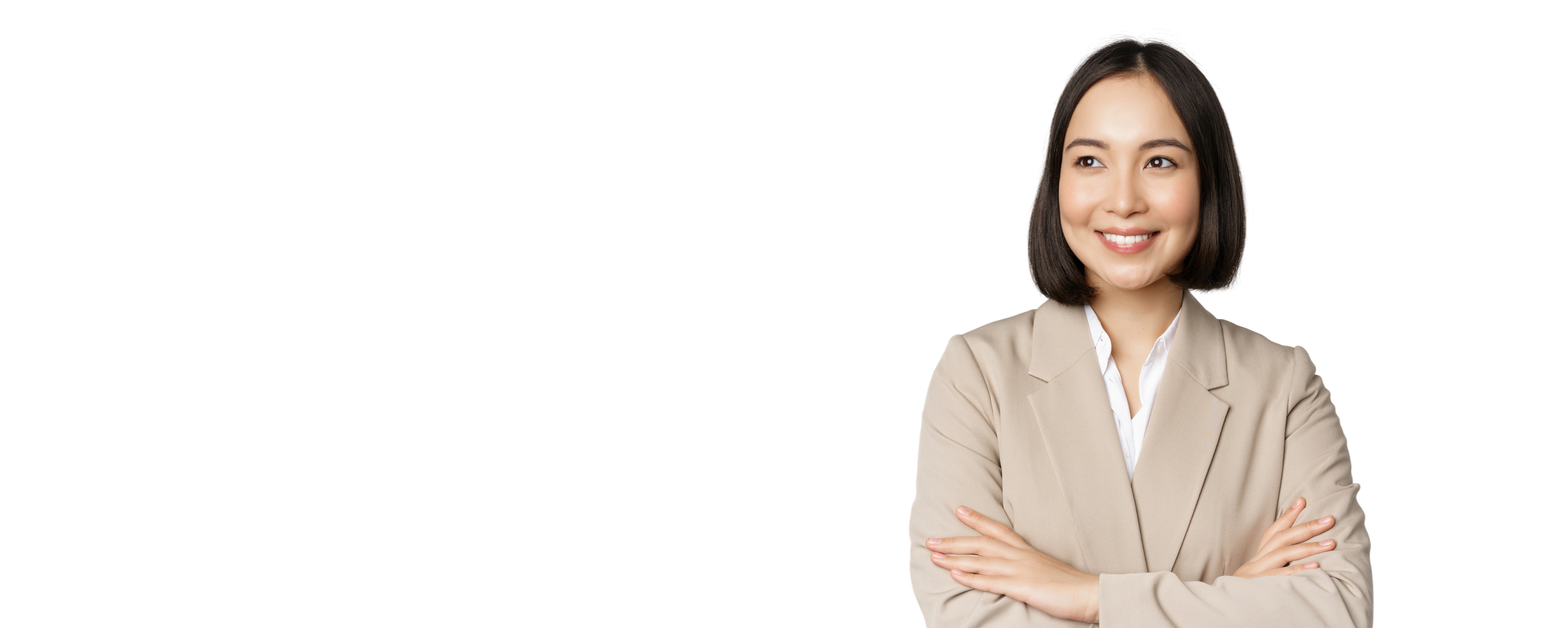 A healthcare administrator smiling with her arms crossed