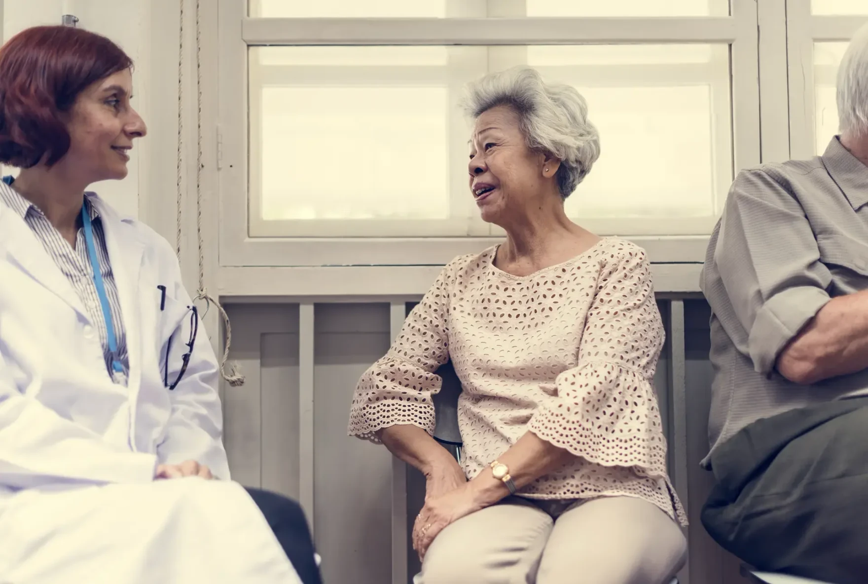 Older patient meeting with a physician in a hospital