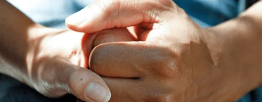 Healthcare professional supporting an older patient