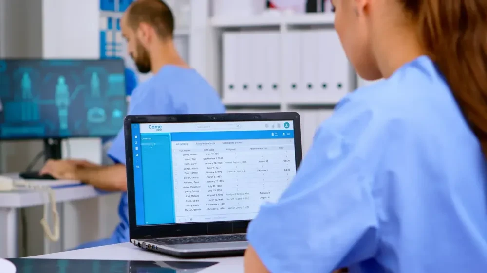 Healthcare staff reviewing medical records